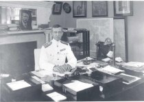 Adm Nulton at desk
